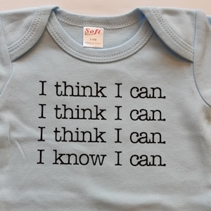 May include: A light blue baby onesie with the text "I think I can. I think I can. I think I can. I know I can." printed in black.