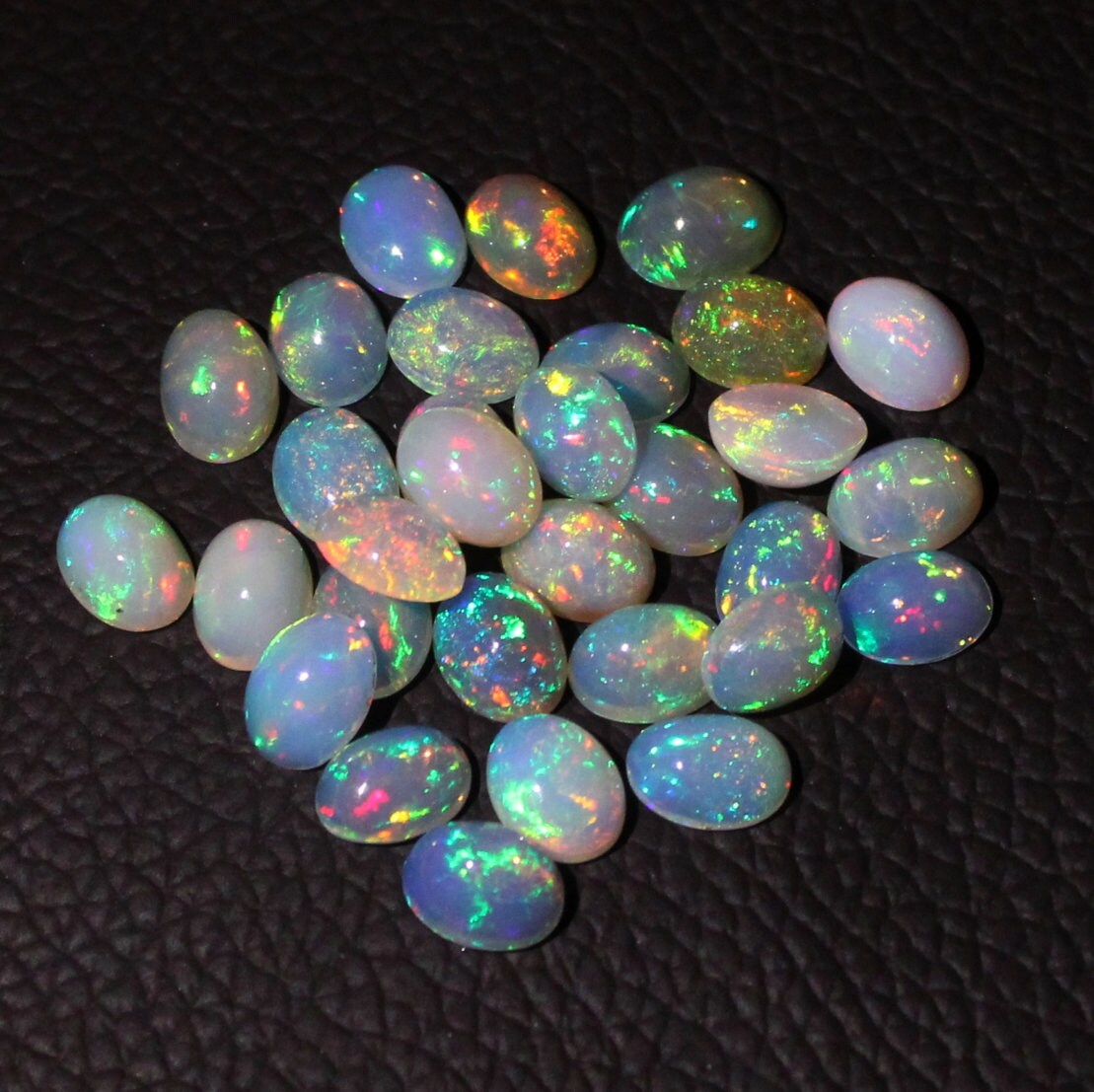 Natural Beautiful Ethiopian Welo Fire Opal Multi-Fire Oval Cabochon Gemstone . Natural Beautiful Ethiopian Welo Fire Opal Multi-Fire Oval Cabochon Gemstone .