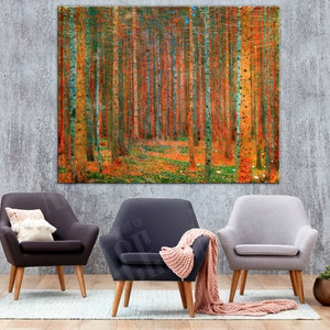 May include: Three armchairs in a living room setting with a large abstract painting of a forest in the background. The armchairs are in different colors: dark gray, light gray, and dark gray with a pink throw blanket. The painting is a vibrant mix of orange, yellow, and green.