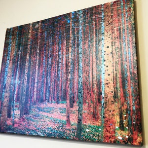 May include: A canvas print of a forest scene with tall, slender trees in shades of blue, green, and red. The trees are arranged in a dense pattern, creating a sense of depth and mystery. The ground is covered in a layer of fallen leaves and small white flowers.