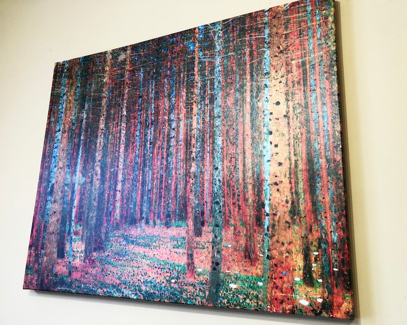 May include: A canvas print of a forest scene with tall, slender trees in shades of blue, green, and red. The trees are arranged in a dense pattern, creating a sense of depth and mystery. The ground is covered in a layer of fallen leaves and small white flowers.