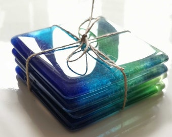 Drinks coaster tiles, handmade from recycled glass in blues and greens. Perfect for a new flat or house gift