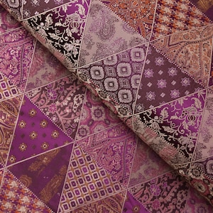 Burgundy triangles pattern brocade fabric. 28 inches wide.