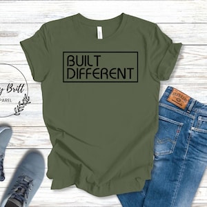 May include: A green t-shirt with the text "BUILT DIFFERENT" in a black box.