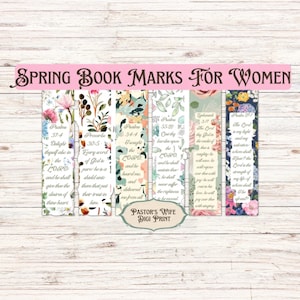 May include: Set of six floral bookmarks with bible verses printed on them. The bookmarks are white with a floral design in shades of pink, green, and blue. The verses are from Psalms, Proverbs, and Ephesians.