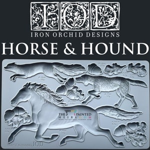 May include: A gray silicone mold with the text "HORSE & HOUND IOD" and a design of a horse and hound running, along with acorns and leaves. The mold is for making fondant or other edible decorations.