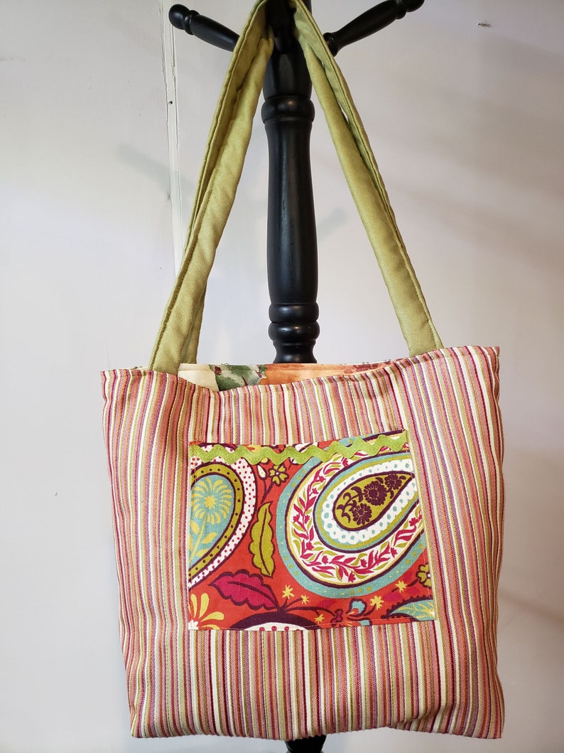 Versatile tote with green faux suede handles