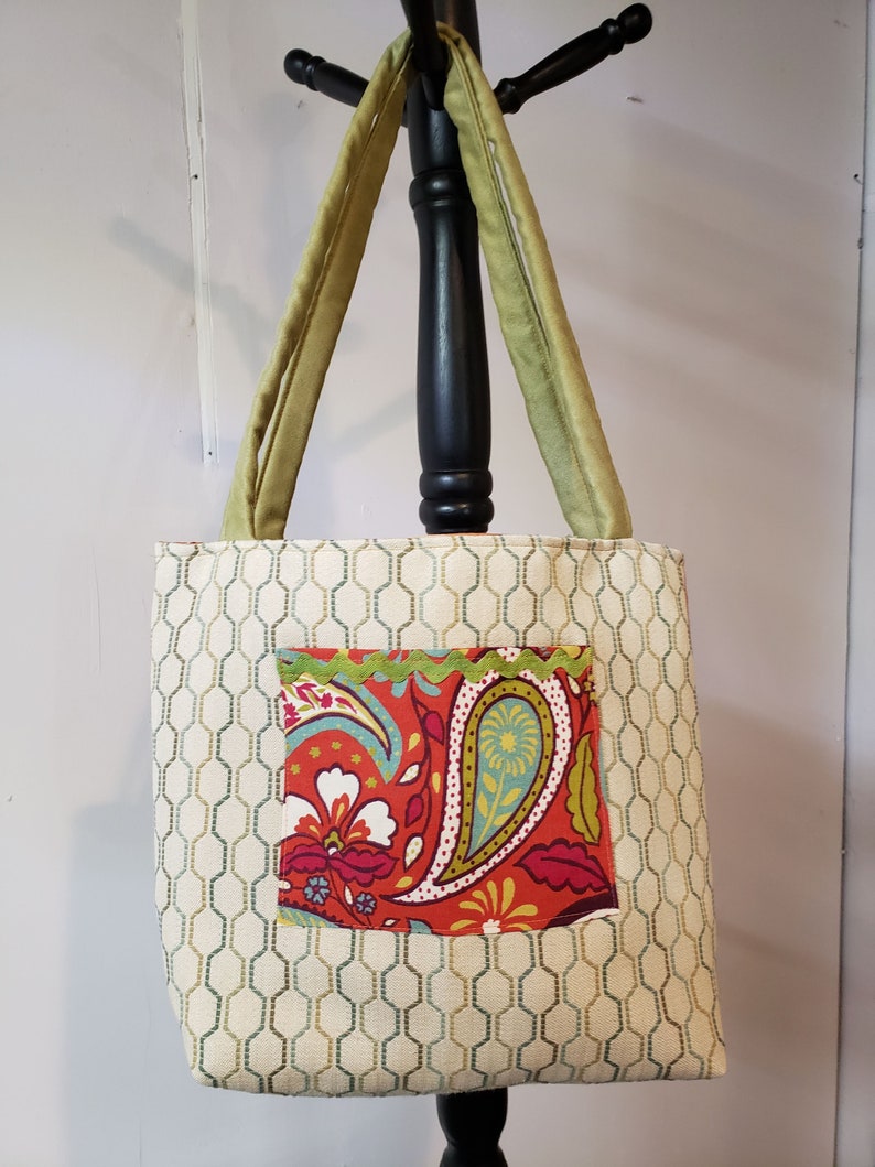 Versatile tote with green faux suede handles