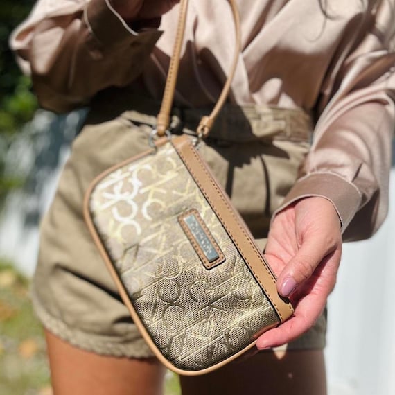 Calvin klein deals gold purse