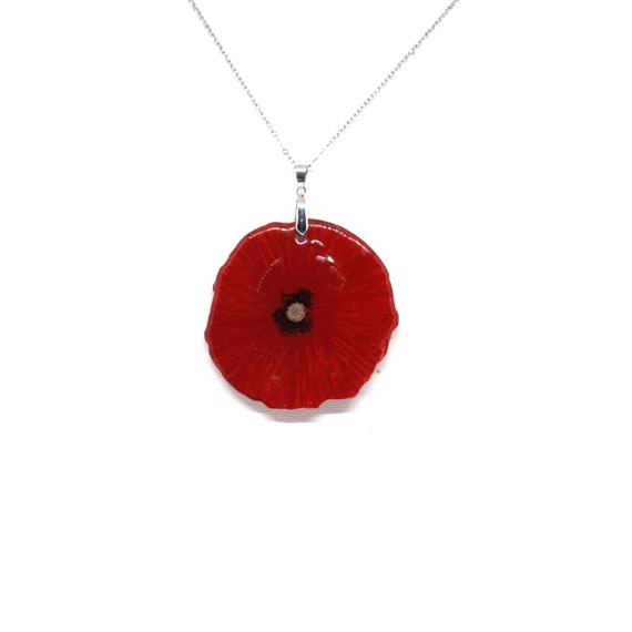 Resin pendant with natural size poppy flower inside