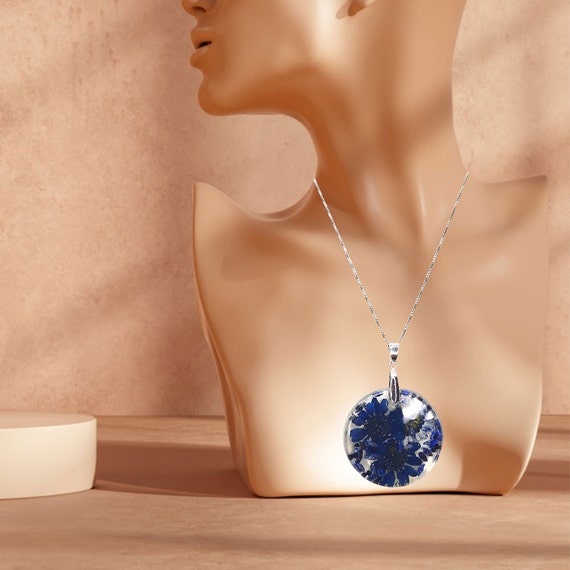 Aesthetic Botanical Pendants: Unique handmade resin pendants with blue seeds and dried daisy flowers
