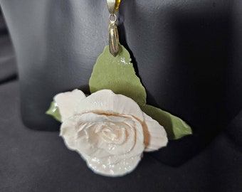 Graceful simplicity: Antique White rose pendant with subtle beige tones. Handcrafted in FIMO, coated with resin for brilliance. Perfect gift