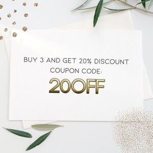 May include: A white card with black text that reads "BUY 3 AND GET 20% DISCOUNT COUPON CODE: 20OFF". The text is in a gold-colored font.