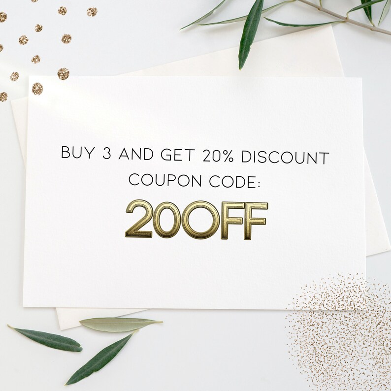 May include: A white card with black text that reads "BUY 3 AND GET 20% DISCOUNT COUPON CODE: 20OFF". The text is in a gold-colored font.