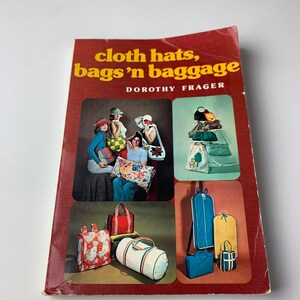May include: A book titled "cloth hats, bags 'n baggage" by Dorothy Frager. The cover features colorful illustrations of hats, bags, and luggage.
