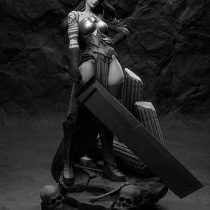 May include: A grayscale figurine of a female warrior, clad in armor and boots, holding a large sword. The figure stands on a rocky base with skulls and broken pillars. The warrior has long hair and a tattoo on her arm.