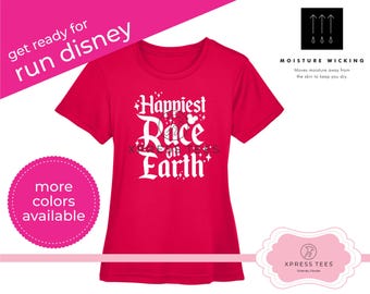 May include: Pink t-shirt with white text that reads "Happiest Race on Earth" with a Mickey Mouse silhouette. The shirt is moisture wicking and is perfect for running.