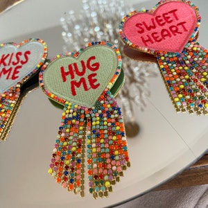 Embroidered statement heart brooch, colorful beaded fringes, three different sayings/colors