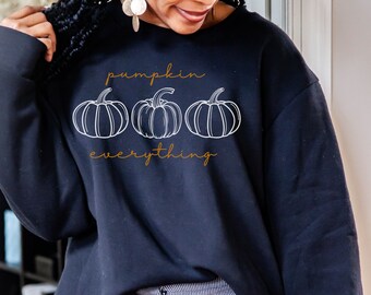 May include: A black sweatshirt with a white graphic of three pumpkins and the text "pumpkin everything" in orange.