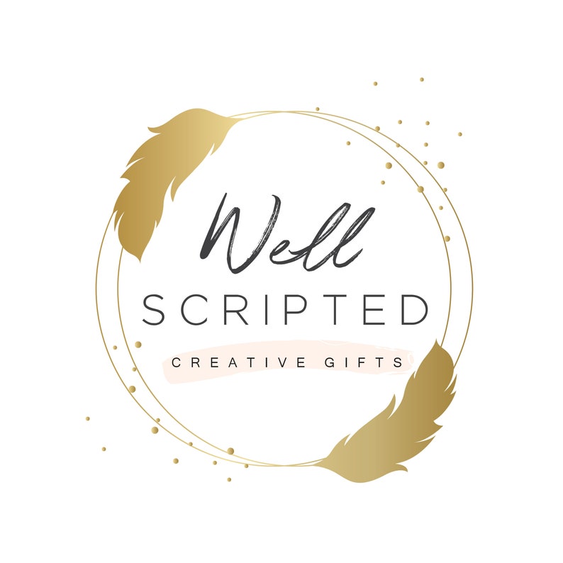 May include: A gold logo with two feathers on either side of a circle. The text "Well Scripted Creative Gifts" is inside the circle.
