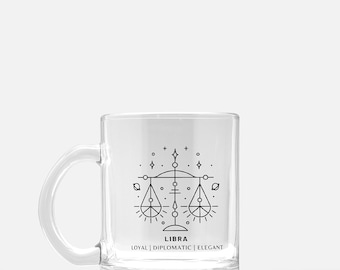 May include: A clear glass mug with a black line drawing of the Libra zodiac symbol and the text "LIBRA" and "LOYAL | DIPLOMATIC | ELEGANT".