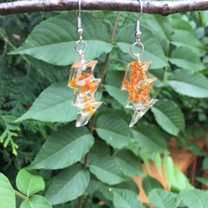 Unique Lightening Bolt Earrings.  Buy single or double.   Marigold petals embedded in hand cast clear resin.  These are a statement piece.