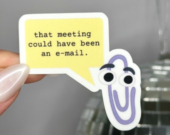 Pode incluir: Um clipe de papel roxo com olhos saltitantes e um balão de fala que diz "essa reunião poderia ter sido um e-mail."