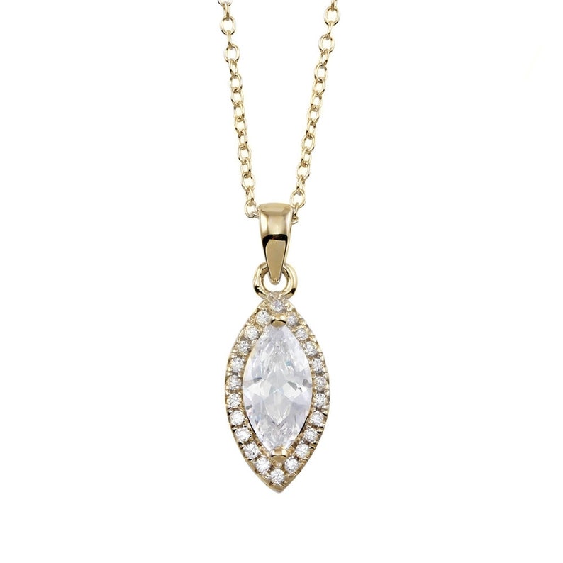 May include: A gold-colored necklace with a marquise-shaped pendant. The pendant features a large, clear, marquise-cut stone surrounded by smaller, round, clear stones. The necklace chain is delicate and also gold-colored.