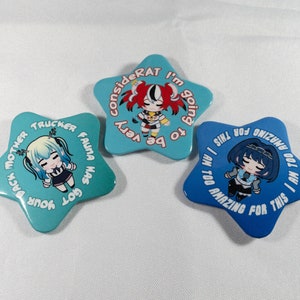 May include: Three star-shaped buttons with different anime characters and text. The first button is blue with the text "I AM TOO AMAZING FOR THIS I AM TOO AMAZING FOR THIS". The second button is blue with the text "GOT FAUNA HAS GOT YOUR BACK MOTHER TRUCKER". The third button is blue with the text "CONSIDERAT I'M GOING TO BE VERY".