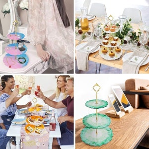 May include: A three-tiered serving tray with a gold handle and colourful resin plates. The plates are pink, blue, and green, and are used to display jewellery and desserts. The tray is a decorative item for home decor and entertaining.