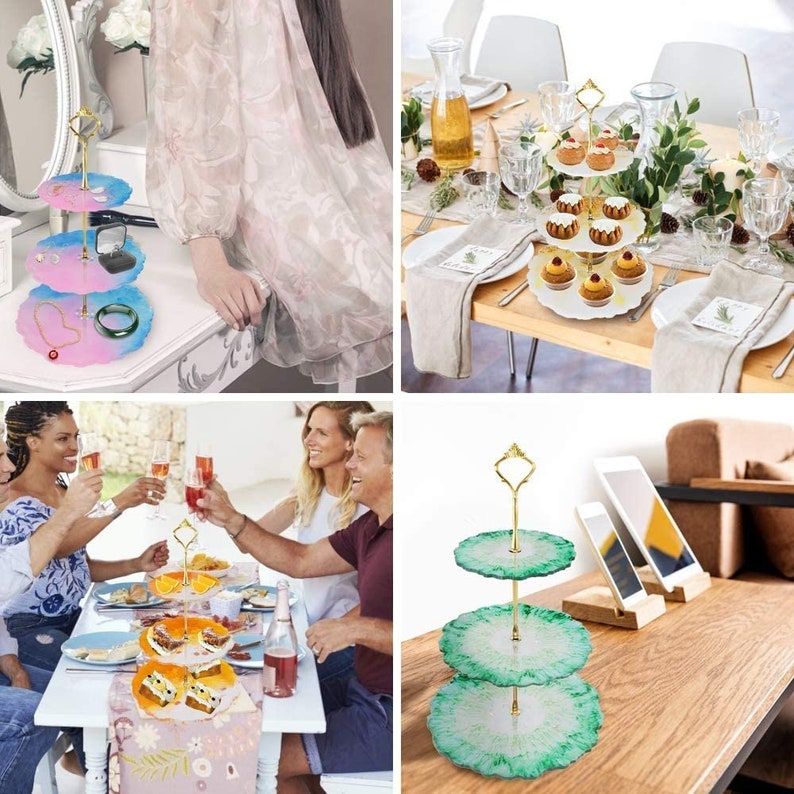 May include: A three-tiered serving tray with a gold handle and colourful resin plates. The plates are pink, blue, and green, and are used to display jewellery and desserts. The tray is a decorative item for home decor and entertaining.