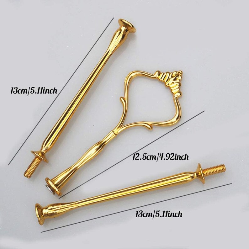 May include: Gold-coloured cake stand hardware set. Includes two 13 cm rods with screw ends and a 12.5 cm handle. The hardware is designed to assemble a tiered cake stand.