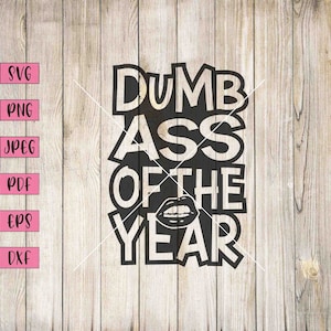 May include: Black and white graphic text design that reads "Dumb Ass of the Year" with a red and black lips graphic in the center.