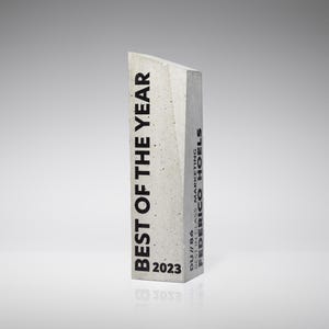 Handmade trophy cast from concrete, personalized prize for best employee, irregular concrete award decorated with UV printing