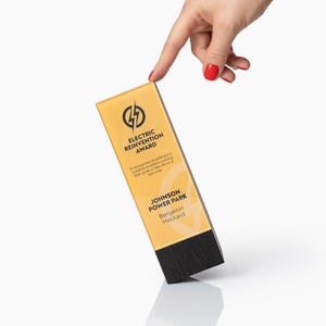 May include: A rectangular award with a yellow top and a black base. The text "ELECTRIC REINVENTION AWARD" is displayed, along with the text "JOHNSON POWER PARK" and "Benjamin Heckard". The award features a lightning bolt logo.