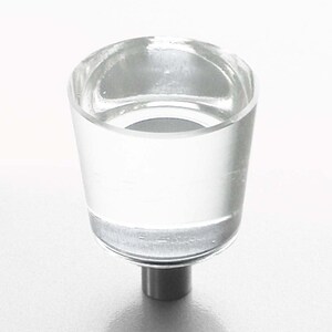 May include: Clear glass cabinet knob with a silver metal base.