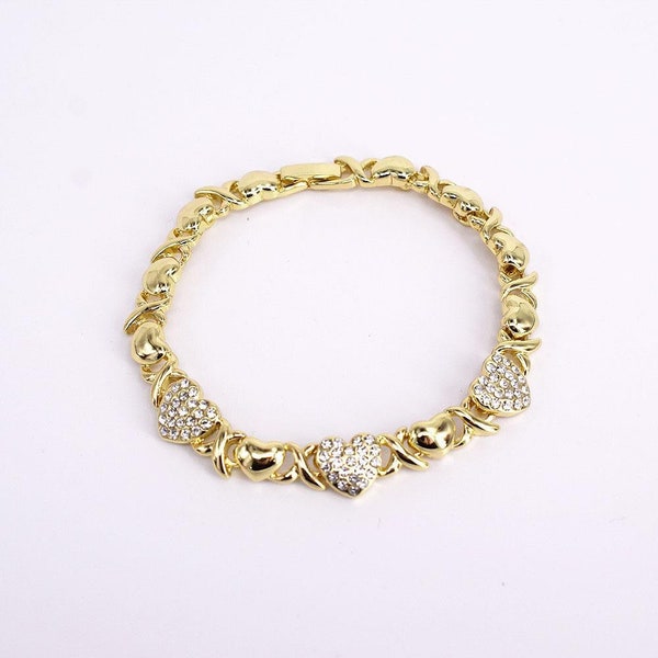 14k gold dipped bracelet. Beautifully linked with plain small hearts and cz diamond hearts for women.