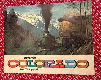 Great mcm full color Colorado souvenir book! nice vintage condition, many frame worthy photos for your ski house or man cave decor!