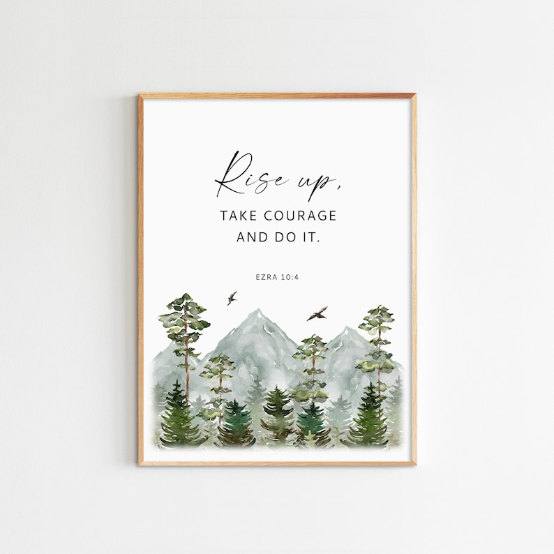 May include: A watercolor print with a quote that reads "Rise up, take courage and do it. Ezra 10:4". The image features a mountain range with trees and birds flying overhead.