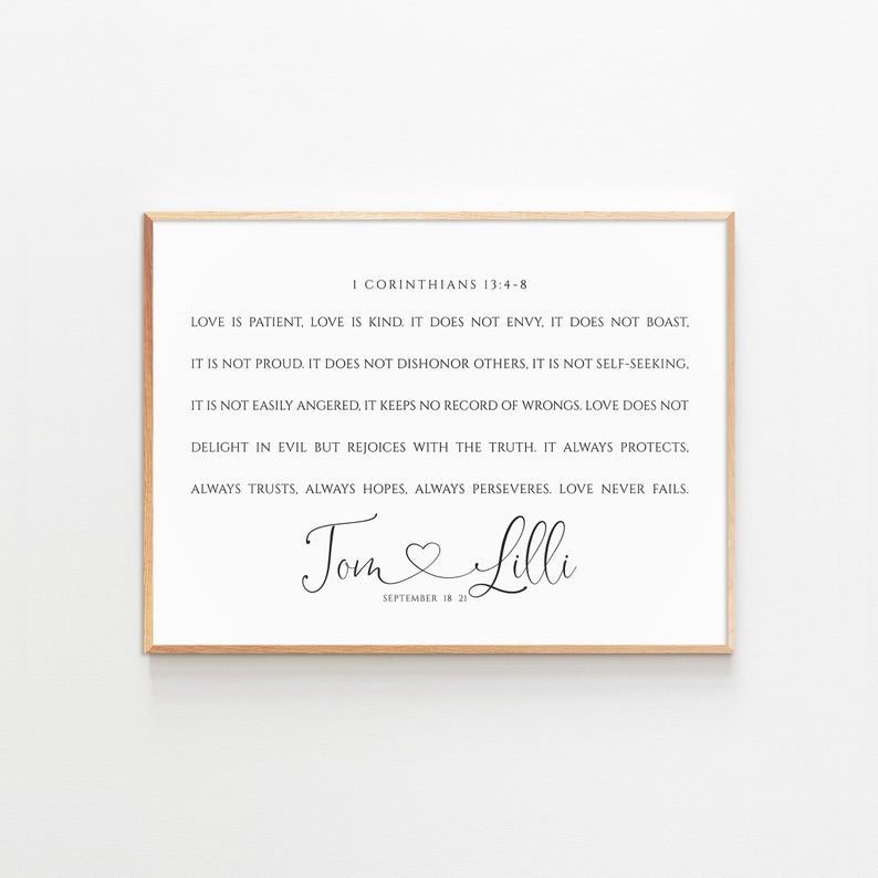 May include: A printable wall art design featuring a quote from 1 Corinthians 13:4-8 about love. The quote is in black text on a white background. The names "Tom" and "Lilli" are written in cursive with a heart symbol between them. The date "September 18 21" is written below the names.