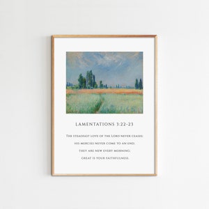 May include: A framed print with a painting of a field with a path leading to a line of trees in the distance. The print includes the text "Lamentations 3:22-23" and the quote "The steadfast love of the Lord never ceases: His mercies never come to an end; They are new every morning: Great is your faithfulness."