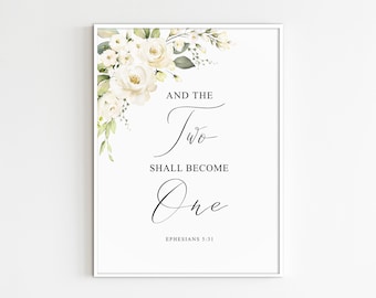 Könnte beinhalten: Weißes florales Hochzeitsschild mit dem Text "Und die zwei werden eins" und dem Bibelvers "Epheser 5,31".