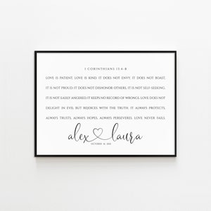 May include: Black and white printable art print with a quote from the Bible, 1 Corinthians 13:4-8, about love. The quote reads "Love is patient, love is kind. It does not envy, it does not boast, it is not proud. It does not dishonor others. It is not self-seeking. It is not easily angered, it keeps no record of wrongs. Love does not delight in evil but rejoices with the truth. It always protects, always trusts, always hopes, always perseveres. Love never fails." The print also includes the names "alex & laura" and the date "October 16, 2021".