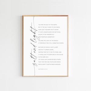May include: A black and white printable wall art print with a quote from the Bible, Matthew 5:13-16, about being the salt of the earth and the light of the world.