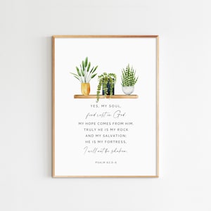 May include: A watercolour print with a shelf holding three potted plants. The print features a bible verse: "YES, MY SOUL, find rest in God: MY HOPE COMES FROM HIM. TRULY HE IS MY ROCK AND MY SALVATION; HE IS MY FORTRESS, I will not be shaken. PSALM 62:5-6"