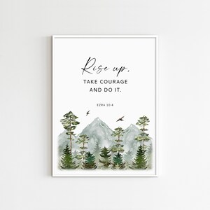 May include: A watercolor print with a quote that reads "Rise up, take courage and do it. Ezra 10:4". The image features a mountain range with trees and birds flying overhead.