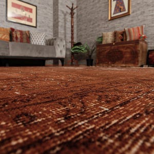May include: A large, rectangular area rug featuring a deep, rich brown color palette with intricate, faded patterns woven throughout the fabric. The rug has a low-pile texture and covers the floor, displaying a distressed, weathered appearance.