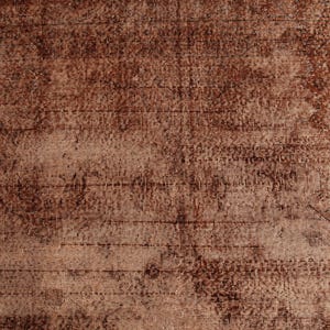 May include: A woven textile surface featuring a deep brown and copper color palette. The fabric displays a distressed, weathered appearance with visible horizontal and vertical thread patterns, creating a textured, mottled, and uneven visual effect.