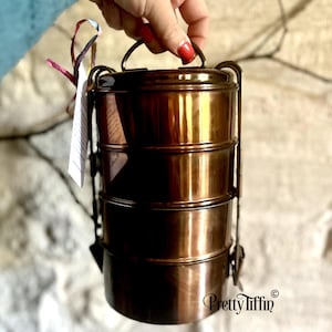 antique lunch dabba. 
lunch carrier. 
Indian tiffin lunchbox  
four compartment lunch tin