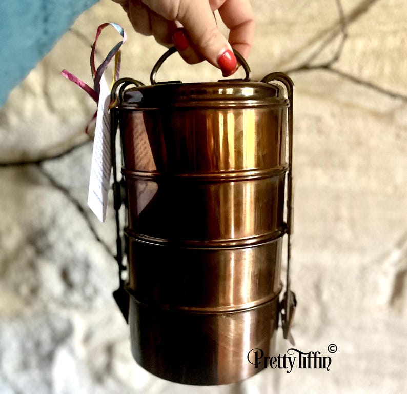 antique lunch dabba. 
lunch carrier. 
Indian tiffin lunchbox  
four compartment lunch tin